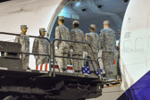Chaplain Major Timothy Bach, U.S. Air Force offers prayer for the fallen on board the aircraft