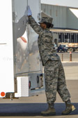 Transfer Vehicle Guide: Senior Airman Zenna Tunnell closing the doors of the transfer vehicle.