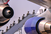 Dover AFB carry team boards aircraft, along with senior ranking officers and chaplain.