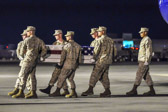 A Marine carry team carries the transfer case containing the remains of L/Cpl. Joshua B. McDaniels, 21, of Dublin, OH upon arrival at Dover Air Force Base, DE on June 14, 2011. The Department of Defense announced the death of McDaniels who was supporting Operation Enduring Freedom – Afghanistan.