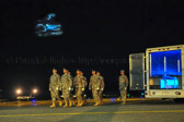 A dignified transfer is the process by which, upon the return from the theater of operations to the United States, the remains of fallen military members are transferred from the aircraft to a waiting vehicle and then to the port mortuary. The dignified transfer is not a ceremony; rather, it is a solemn movement of the transfer case by a carry team of military personnel from the fallen member's respective service. A dignified transfer is conducted for every U.S. military member who dies in the theater of operation while in the service of their country. A senior ranking officer of the fallen member's service presides over each dignified transfer.