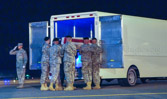 Carry team carries transfer case of Spc. Clarence Williams to the mortuary transfer vehicle