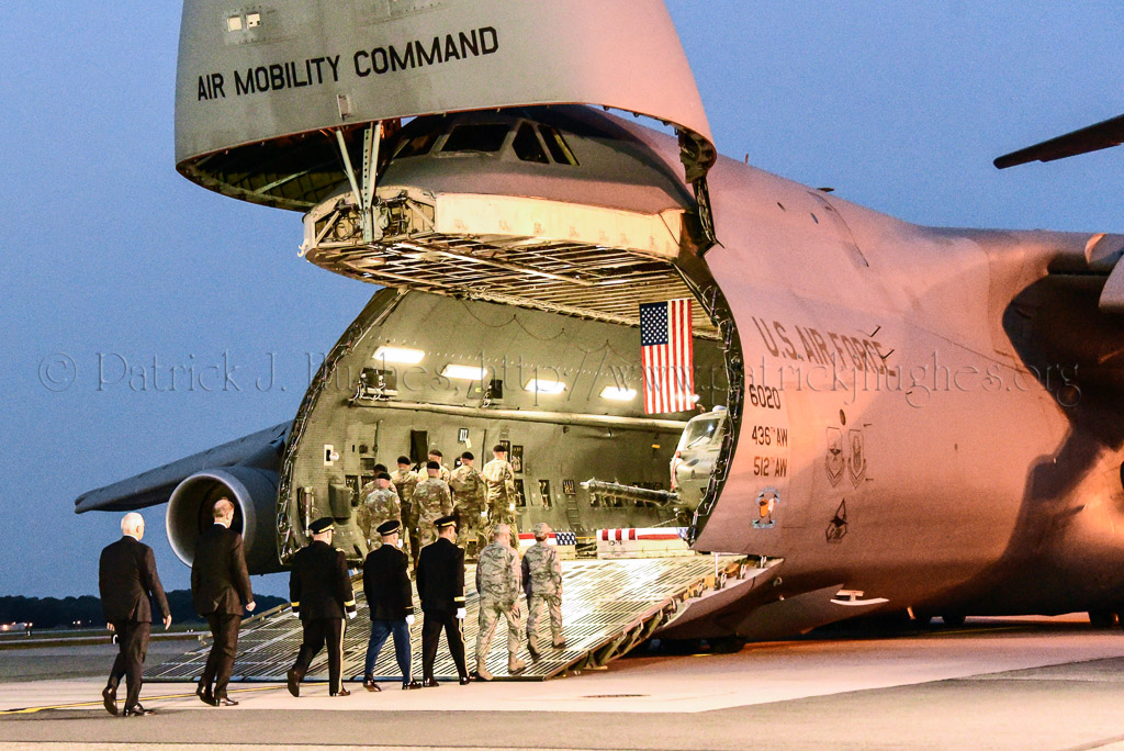 Official party boards the aircraft. <br />Vice President of the United States Michael Pence, Chief of Staff of the Army General Mark A. Milley, Under Secretary of the Army Karl F. Schneider, Sergeant Major of the Army Daniel A. Dailey, Brigadier General Brian J. Mennes and Col. Dawn C. Lancaster, Commander, Air Force Mortuary Affairs Operations