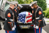 Marine body bearers prepare to move the remains of Marine Pvt Emil F. Ragucci into  the John F. Murray in  Flourtown, PA