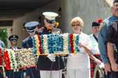 National Gold Star Mother President Judith Young escorted by a Marine carrying in a wreath