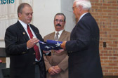 Gold Star Fathers holding American flag during ceremony