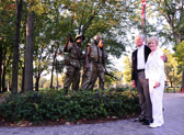Sculptor Frederick Hart's statue grouping has been called both The Three Soldiers and The Three Servicemen. The men are wearing Vietnam War era uniforms and could be from any branch of the U.S. military at that time. Interpretations of the work vary widely. Some say the troops have the "thousand yard stare" of combat soldiers. Others say the troops are on patrol and begin looking for their own names as they come upon the Memorial.