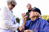 A 'Honor Flight' World War II Veteran from Bakersfield, CA chats with Gold Star Mother at The Wall.