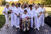 Fred Borsari a 'Honor Flight' Navy World War II Veteran from Florida poses with some Gold Star Mothers at The Wall.