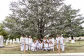 Gold Star Mothers posed for a photo at a tree that had been planted in their honor in Arlington National Cemetery