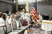 Carol Resh carrying our National ensign and Sarah Taylor with AGSM National Banner.