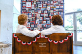 Gold Star Mothers Vickie Castro and Karen Meredith reflecting on the “Stitches Of Freedom” quilt.