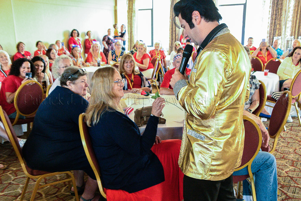 Elvis giving out Red roses to the Moms.