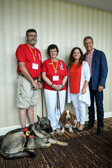 Andy and Cindy Tatum along with Tennessee Governor Bill Lee and his wife Maria.  Service dogs Milley and Linus.