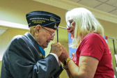 Hershel "Woody" Williams prays along with Gold Star Mother Elaine Brattain, National Chaplain