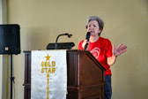 Sue Reich, President of Quilts Of Valor® Foundation announcing names of those presented with their Quilts Of Valor.