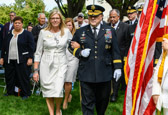 General Mark A. Milley, Chairman of the Joint Chiefs of Staff escorts Gold Star Mothers National President Sarah Taylor to the podium for the start of ceremonies.
