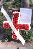 This wreath is to honor four women who served as American Red Cross Supplemental Recreation Activities Overseas workers in Vietnam. Our job would be more accurately describe as ‘Field Morale Workers’ because we spent our days traveling to the forward areas to talk with, laugh with, and listen to American servicemen who loved to talk about home and to laugh for a few minutes with American women who, for many different reasons, choose to be in Vietnam with them instead of home where we’d be ‘safe’. Hannah Crews died in a jeep accident, Bien Hoa, October 2, 1969. Virginia Kirsch murdered by a U.S. soldier in Cu Chi, August 18, 1970. Lucinda Richter died of Guillain-Barre syndrome, Cam Ranh Bay, February 9, 1971. Sharon Wesley died in ‘Operation Baby Lift’ near Saigon, April 4, 1975. Their names are not on ‘the Wall’ because we were civilians . . . technically. For myself, it was very difficult to feel like a civilian when I came home because my tour in Vietnam had changed me forever. With ‘our guys,’ we had shared a time together of intense sorrow (although we had almost never cried in Nam), intense laughter, and intense LIFE. Today, and every day, we acknowledge the loss of our sister ‘Donut Dollies’ and reaffirm that we will never forget them . . . NEVER!
