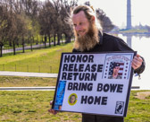 Bob Bergdahl showing off a HONOR-RELEASE-RETURN poster with his son Sgt Bowe Bergdahl image