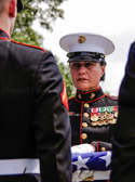 Marine Corps Sergeant Major Angela M. Maness receives our national colors to be presented to the family of  PFC Jonathan Reed Posey, Jr