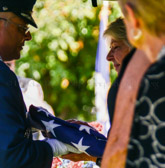 Our American Flag is presented to the ex-wife.
