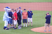 Wounded Warrior Joshua Fry got to throw out the First pitch then posed for a photograph with the other Wounded Warrior Veteran heroes.