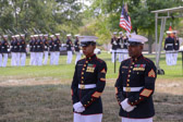 1st Sgt Patricia Trotter and MSgt Leonard J. Spain await the hearse containing the remains of Marine PFC Randolph “Bud” Allen.