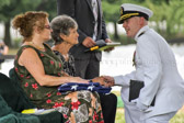 Navy Chaplain extending his condolences to Joan Marie (Carter) Nusbaum surviving sister of PFC Robert Junior Carter.