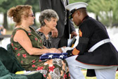 Marine Master Gunnery Sergeant Leonard J. Spain extends his condolences to Joan Marie (Carter) Nusbaum surviving sister of PFC Robert Junior Carter.