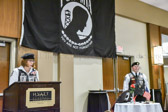 Rolling Thunder® National Secretary Elaine Johnston Martin explaining items and there meanings on the missing man table.