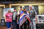 Former Vietnam POW Mike Benge is wrapped in a hand made quilt.