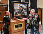 NY Myke congratulates Artie Muller ( Executive Director Rolling Thunder ) while painting of Artie and his grandson Gavin is unveiled.