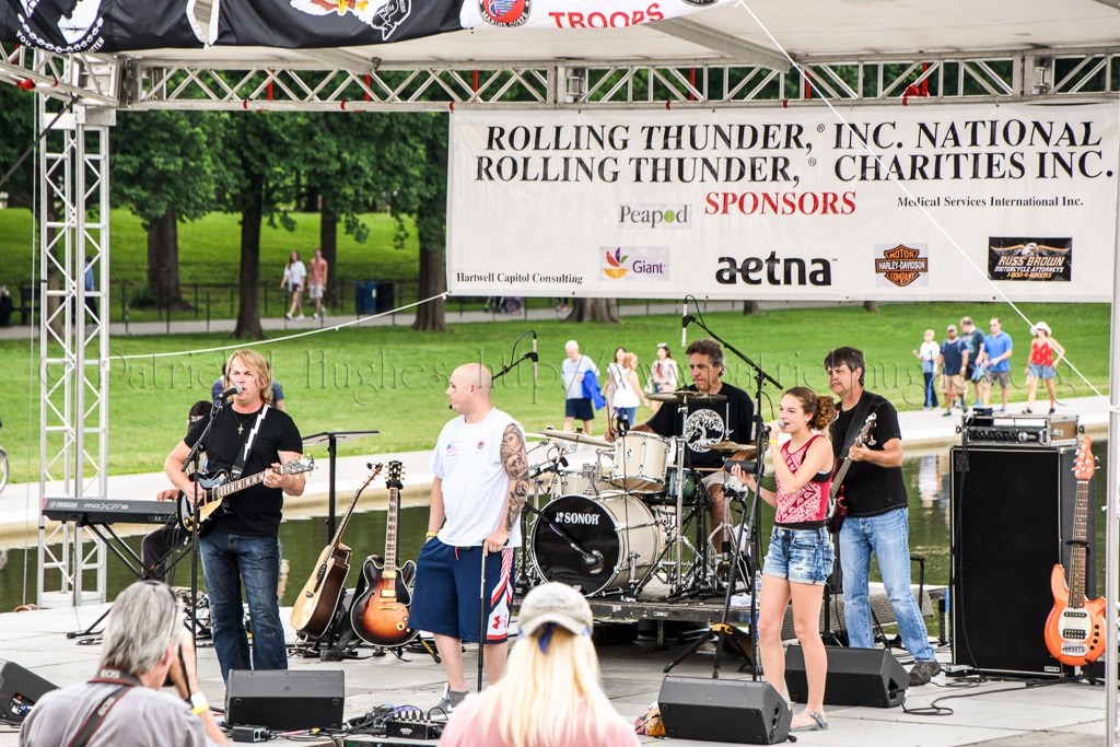 Rockie Lynne and his group playing a musical tribute to our Wounded Warrior on stage.