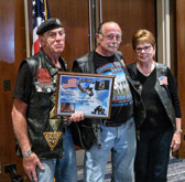 Joe Bean National President presents Artie and Elaine Muller with a plaque for all of their many years of service to Rolling Thunder.
