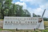 The National Museum of the Marine Corps is a lasting tribute to U.S. Marines--past, present, and future. Situated on a 135-acre site adjacent to Marine Corps Base Quantico, Virginia, and under the command of Marine Corps University, the Museum's soaring design evokes the image of the flag-raisers of Iwo Jima and beckons visitors to this 120,000-square-foot structure. World-class interactive exhibits using the most innovative technology surround visitors with irreplaceable artifacts and immerse them in the sights and sounds of Marines in action.