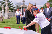 Sandra Krautheim of the Upper Darby Marine Corps League Ladies Auxiliary places her rose on Sargent Major Alfred L. DeSerio casket