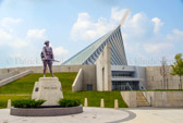 The National Museum of the Marine Corps Museum is located in Triangle, Virginia just outside the gates of Quantico, the museum opened on November 10, 2006, . It's striking architecture is reminiscent of the famous statue of the flag being raised on Iwo Jima by the Marines during World War II.