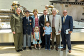 Major General James W. Lukeman, C. J. Daigle (USMC Maj (ret) , Jennifer Noah with daughter Lynn, Mark Noah with son Phineas, Michael W. Snead and Matt Noah.