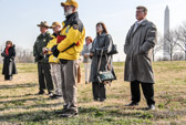 Wall Volunteers, Park Ranger and Guests listen to remarks.