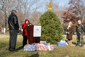 Volunteers reading some of the greetings before the tree is placed at the apex of The Wall.