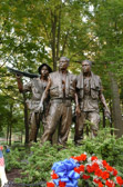 The Caucasian figure was modeled after James E. Connell, III, then a Corporal in the Marines; the African-American figure was modeled after three men, Marine Corporal Terrance Green, Rodney Sherrill and Scotty Dillingham; the Hispanic figure was modeled after Guillermo Smith De Perez DeLeon.
