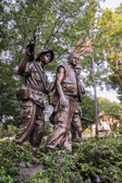 These three figures were based on six actual young men models, of which two (the Caucasian, and the African-American) were active-duty Marines at the time that the sculpture was commissioned.