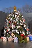 A few days before Christmas each year, visitors to the Vietnam Veterans Memorial have the opportunity to help decorate a Christmas Tree at the apex of The Wall. The tree is adorned with ornaments made by school children from all across the country as well as thousands of cards sent to VVMF each December to honor those who served with the U.S. Armed Forces in Vietnam and other military conflicts and their families. We also remember those who are serving our country all across the world today.
