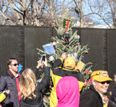 After the ceremony, the tree and many boxes of cards and ornaments will be left at The Wall, so that visitors can read the messages and add decorations when they visit throughout the holidays.