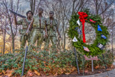 In January 1982, the decision was made to add a flag staff and sculpture on the memorial site in order to provide a realistic depiction of three Vietnam servicemen and a symbol of their courage and devotion to their country. On March 11, 1982, the design and plans received final Federal approval, and work at the site was begun on March 16, 1982. Ground was formally broken on Friday, March 26, 1982. <br />In July 1, 1982, the Memorial Fund selected Washington, D.C. sculptor Frederick Hart to design the sculpture of the servicemen to be placed at the site. On October 13, 1982, the U.S. Commission of Fine Arts unanimously accepted the proposed sculpture and flag staff. <br />Construction at the site was completed in late October 1982, and the Memorial was dedicated on November 13, 1982. The Three Servicemen statue was added in 1984.