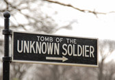 Under authority of public resolution 67, of the 66th Congress, approved March 4, 1921, an unknown American soldier was exhumed from each of the four American cemeteries in France. They were place in identical caskets and assembled at Chalons Sur Marne. The Unknown Soldier was selected on October 24, 1921. Sergeant Edgar F. Younger, US Army, carrying a spray of white roses, entered the room where the four unmarked flag-draped caskets were resting. He slowly circled, silently placing the roses on one of the caskets. Thus the Unknown Soldier was officially designated. The three remaining Unknowns were then returned to the Meuse Argonne Cemetery. The Unknown Soldier was placed aboard the US Cruiser Olympia, which arrived at the Nation’s Capital on November 9, 1921. The honored remains were taken to the rotunda of the United States Capital, to rest in state until Armistice Day. On November 11, the Unknown Soldier was moved to the Memorial amphitheatre, in Arlington National Cemetery. After services in the amphitheater, the remains were borne to the sarcophagus for brief committal rites. The impressive service closed with three salvos of artillery, the sounding of taps, and the National salute.