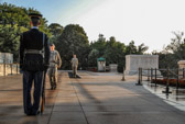 As the active sentry nears the conclusion of his walk, a uniformed relief commander enters the plaza to announce the Changing of the Guard. The relief commander approaches the tomb, slowly salutes, then faces the visitors and requests silence during the ceremony.