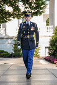 As the active sentry nears the conclusion of his walk, a uniformed relief commander enters the plaza to announce the Changing of the Guard.