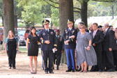 Army Officer and Chaplin escorting Lucas's Wife Trisha and his Mother Patti Elliott.
