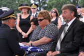 Patti Elliott is presented with her American flag.